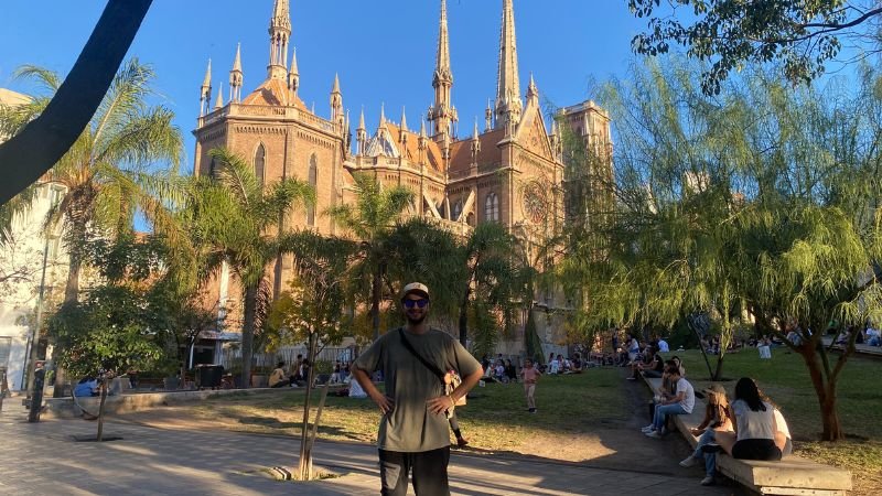 a man standing in front of a building in cordoba argentina